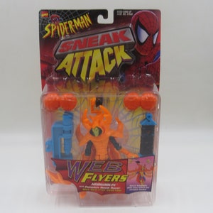 May include: Spider-Man "Sneak Attack" Web Flyers action figure set featuring the Hobgoblin and Pumpkin Bomb Racer. The packaging includes the Spider-Man logo and character art, with orange, blue, and black accessories.