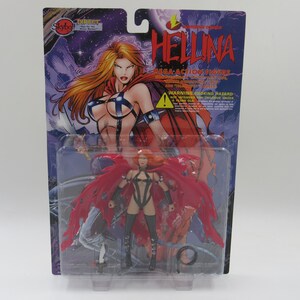 May include: A red and black action figure of a female character with wings and a whip. The figure is packaged in a plastic blister pack with a cardboard backing. The backing features a comic book style illustration of the character and the text "Hellina Mega Action Figure".