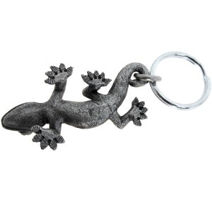 May include: A detailed, grey metal lizard keyring. The lizard is shown crawling, with textured skin and detailed feet. A silver-coloured key ring is attached to the lizard's back, ready for keys.