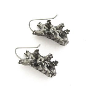 May include: A pair of silver-toned earrings shaped like tardigrades, also known as water bears. Each earring features a textured, segmented body with multiple small legs and a curved metal ear wire for attachment, showcasing a dark, oxidized finish.