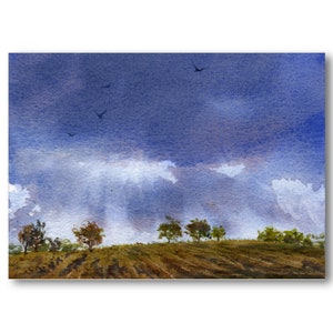 May include: Watercolor painting of a landscape with a dark blue sky filled with clouds and birds. A brown hill with trees is in the foreground. The artwork has a soft, textured appearance.