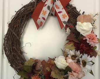 Fall/Autumn grapevine wreath. Peach, cream, white, and dark orange flowers.