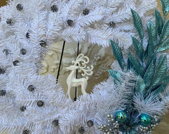 White Winter Wreath: Turquoise Leaves and Poinsettias, White Majestic Glitter Deer & Silver Pine Cones