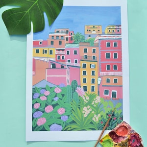 May include: A colourful illustration of a row of buildings with a lush green garden in the foreground. The buildings are painted in shades of pink, yellow, and blue, and the garden features green plants and pink flowers.