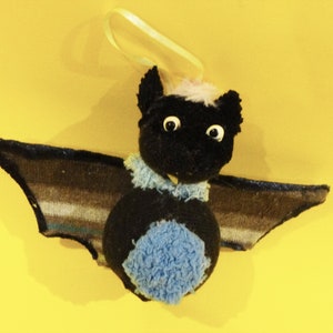 Cute little bat with stripey wings to hang up!
