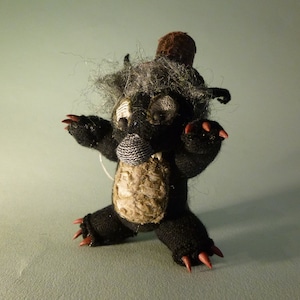 Little werewolf with leather tophat and sharp, fierce claws and fangs! To hang up!