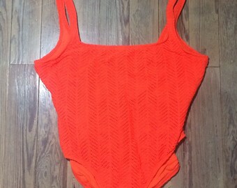 Bright orange perforated/ die cut one piece bathing suit