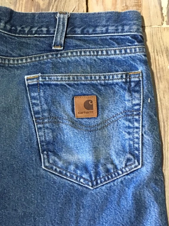 Artist/carpenter worn carhartt jeans raw hem - image 1