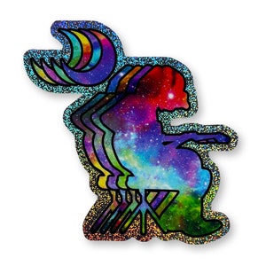 May include: A holographic sticker featuring a colorful, galaxy-themed silhouette of a person sitting on a chair. The sticker has a rainbow crescent moon design in the upper left corner.