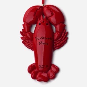 May include: Red lobster Christmas ornament with the text "Rockport, Maine 2019" on the body.