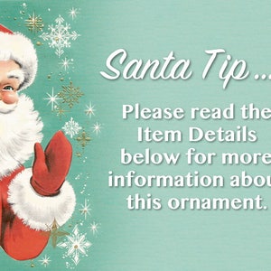 May include: A vintage Christmas card featuring a cartoon Santa Claus with a white beard and red suit. He is holding out his gloved hand and smiling. The background is a light blue with white snowflakes and gold stars. The text on the card reads "Santa Tip... Please read the Item Details below for more information about this ornament."