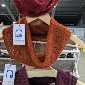 100% qiviut hand knit mobius each one is unique in that the pattern is free form meaning no two are alike Hand Knitted Mobius Hand Dyed Shown in Cranberry Willow and Raspberry Made in Alaska A circular Scarf worn around the neck
