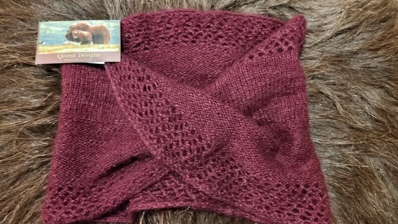 100% qiviut hand knit mobius each one is unique in that the pattern is free form meaning no two are alike Hand Knitted Mobius Hand Dyed Raspberry Made in Alaska A circular Scarf worn around the neck
