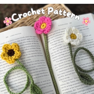 May include: Crochet flower bookmarks in yellow, pink, and white, with green stems and leaves, rest on the pages of a book. The words "Crochet Pattern" are at the top of the image.