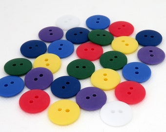 18mm round flat matte smartie buttons baby buttons 2 holes blue pink yellow green 7 colours machine washable available in 10s 20s and mixed