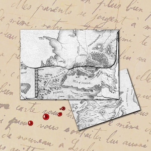 May include: A black and white map of the fictional land of Dorne from the book series 'A Song of Ice and Fire' by George R.R. Martin. The map shows the Dornish Marches, the Sea of Dorne, and the surrounding areas. The map is printed on a piece of paper with a worn, aged look.
