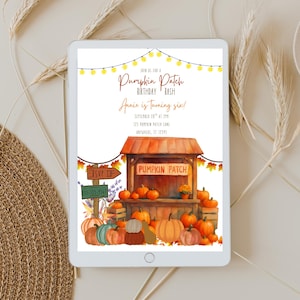 May include: A digital tablet displays a watercolor-style invitation for a "Pumpkin Patch Birthday Bash." The design features a pumpkin patch scene with pumpkins, a wooden stand, and string lights. Text includes the birthday girl's name, age, date, time, and location.