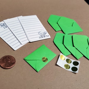 Dúzia de papéis para cartas com 6 envelopes minúsculos