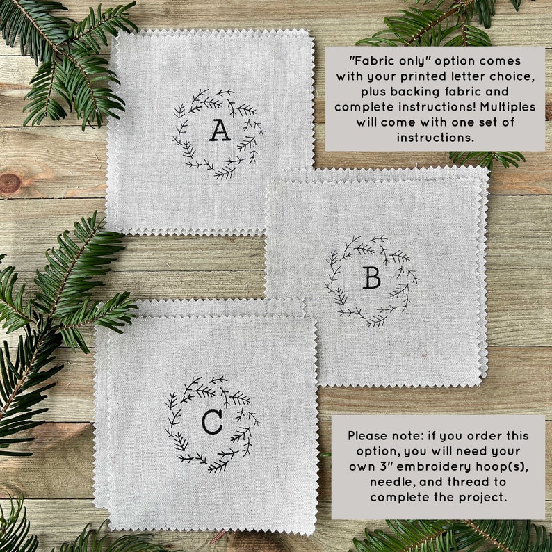 May include: Three white linen squares with a black embroidered wreath and letter in the center. The letters are A, B, and C. The text "Fabric only" option comes with your printed letter choice, plus backing fabric and complete instructions! Multiples will come with one set of instructions. Please note: if you order this option, you will need your own 3" embroidery hoop(s), needle, and thread to complete the project." is visible in the image.