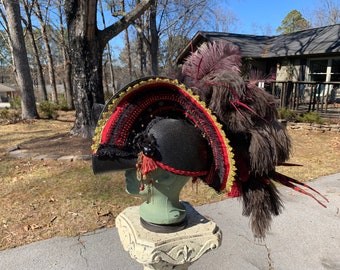 Embellished Pirate Hat: Red & Black Theatrical Costume with Feathers