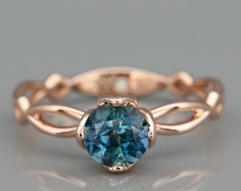 Verlovingsring met turkooizen saffier | 14k roségouden ring bezet met een natuurlijke turkooizen saffier en een gratis verborgen diamant.