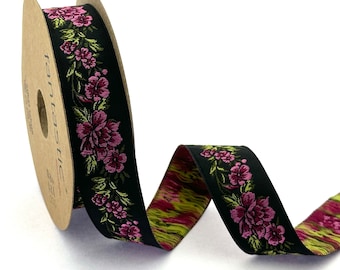 Puede incluir: Cinta negra con un patrón floral en rosa y verde. La cinta está en un carrete con la palabra "fantástico" impresa en él.