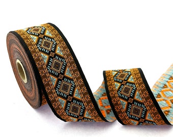 May include: A brown, black, blue, and orange patterned trim with a geometric design. The trim is rolled up on a spool.