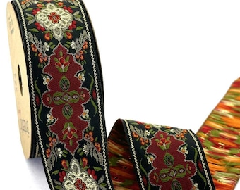 May include: A spool of woven ribbon featuring a black background with a repeating pattern of deep red, olive green, and metallic gold floral motifs. The edges are finished with a thin, decorative gold border, and the reverse side shows an orange pattern.
