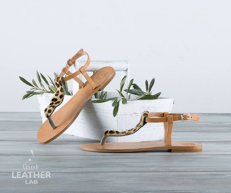 Close-up leopard T-Strap and buckle closure — HYDRA