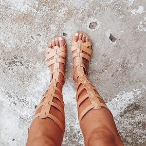Woman wearing natural gladiator sandals — minimalist summer look