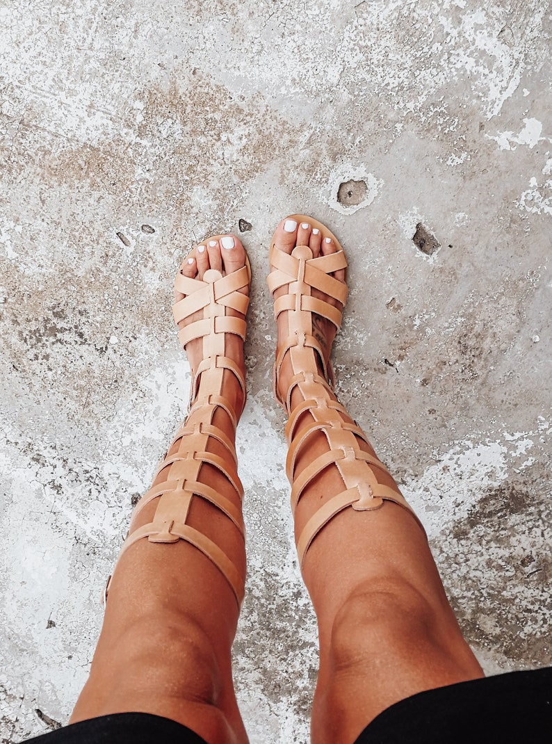 Woman wearing natural gladiator sandals — minimalist summer look