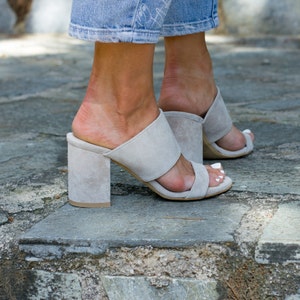 Close-up Suede Upper — back view of open heel and wide Strap Detail