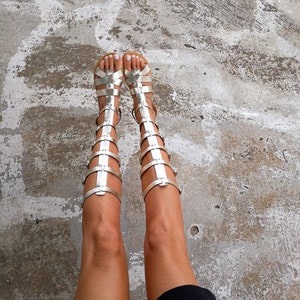 Gold gladiator leather sandals — women’s Greek knee high flats
