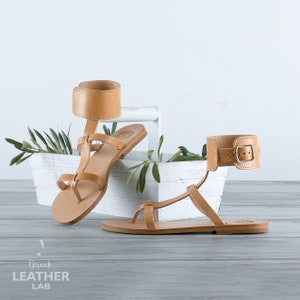 Side profile of the natural leather ankle cuff sandal style, showing the low 1.2cm heel height.