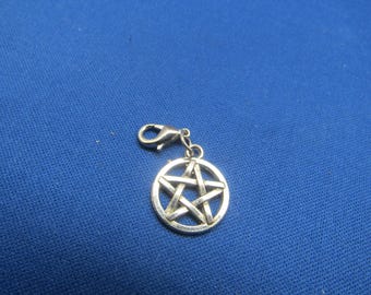 May include: Silver charm with a pentagram design. The charm has a lobster claw clasp.