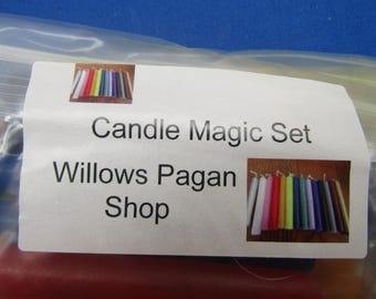May include: A set of colourful candles in a clear plastic bag with a label that reads "Candle Magic Set Willows Pagan Shop".