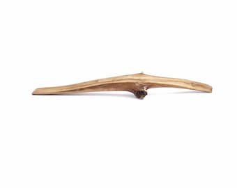 May include: A light brown, weathered, wooden branch with a knot at one end.