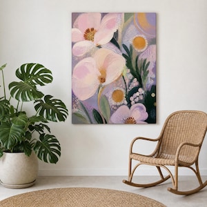 May include: A rectangular canvas wall art piece featuring an abstract floral painting with large, soft pink petals, textured yellow centers, and deep green foliage against a light purple and lavender background with visible brushstroke textures.
