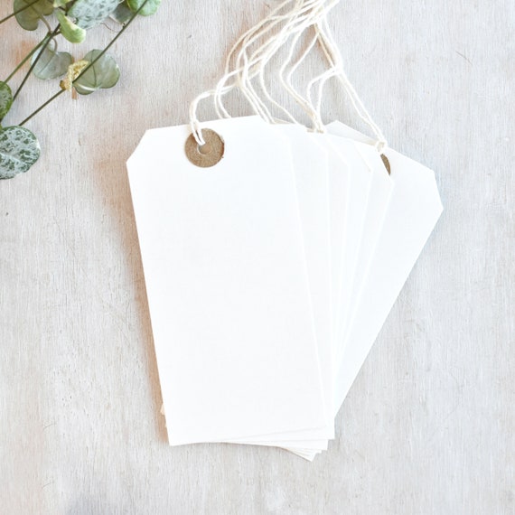 white luggage tags