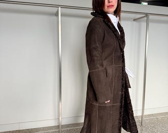 Full grain Reversible brownish Swakara lamb fur coat with cinnamon suede leather side and tie belt. Velour touch suede fitted Fur stroller.