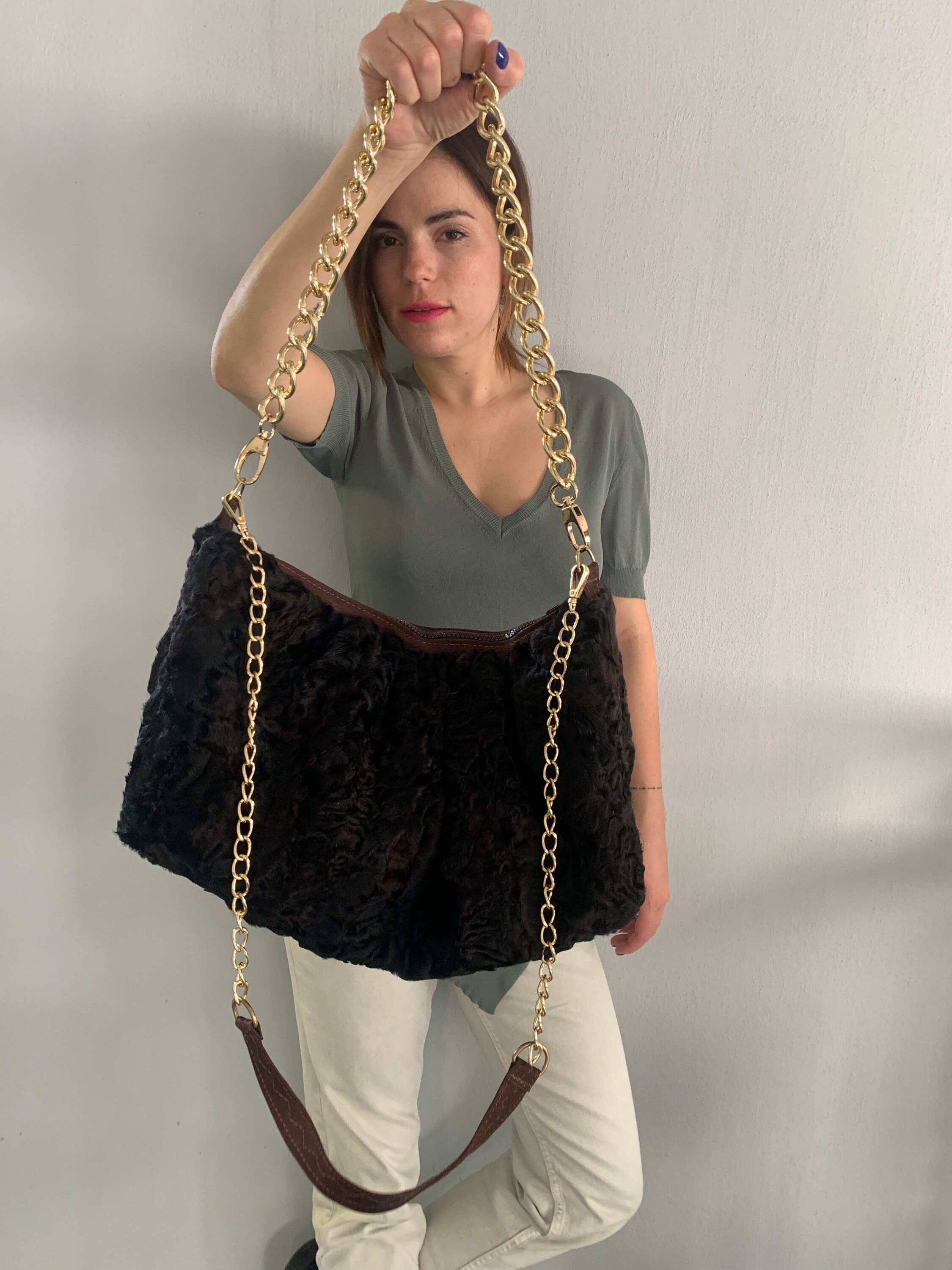 Real cloud pouch lamb fur in brown slouchy shoulder bag with two bronze straps. Unique Luxury fur gift cross-bag.