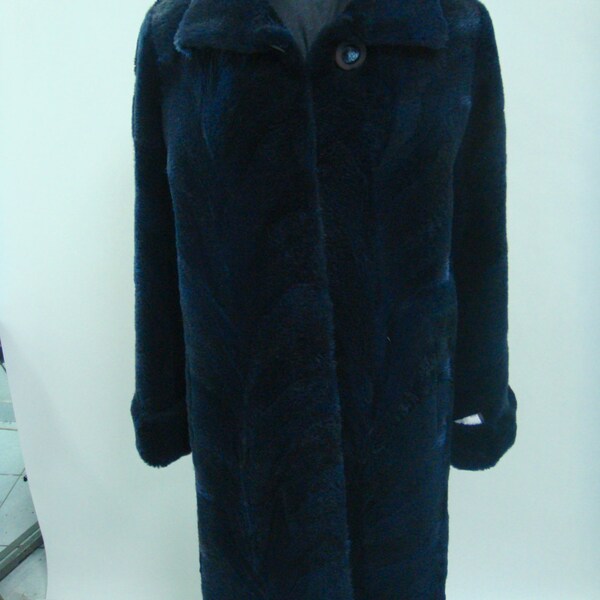 Navy - blue sheared raccoon fur coat with double cuffs.