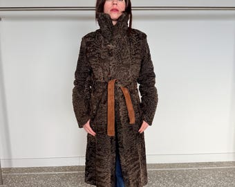 Full grain Reversible brownish Swakara lamb fur coat with cinnamon suede leather side and tie belt. Velour touch suede fitted Fur stroller.