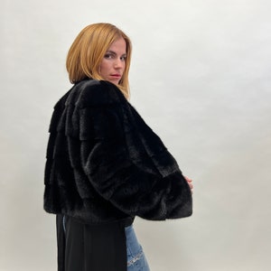Real mink fur horizontal collared short jacket. Saga lavish black supple mink fur overcoat full skin fur. Affordable luxury fur gift.