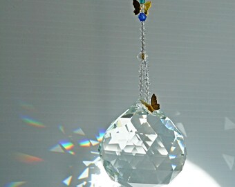 Butterfly suncatcher with green and blue accents. Big crystal ball to make rainbows plus golden butterflies. A special gift or just for you.