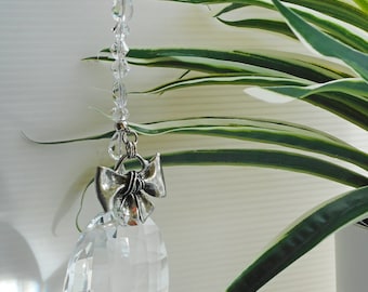 Big oval crystal suncatcher. Silver bow accent, minimalist design, retro vintage style. Beautiful gift, window décor accent, very elegant.