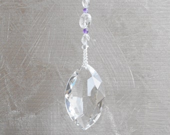 February suncatcher, gift of amethyst for Aquarian birthdays. Large prism in a marquise shape teamed with crystal and two types of amethyst.