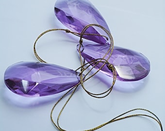 Plain suncatcher, three prisms on a golden cord. Easy gift solution and colourful window accent.