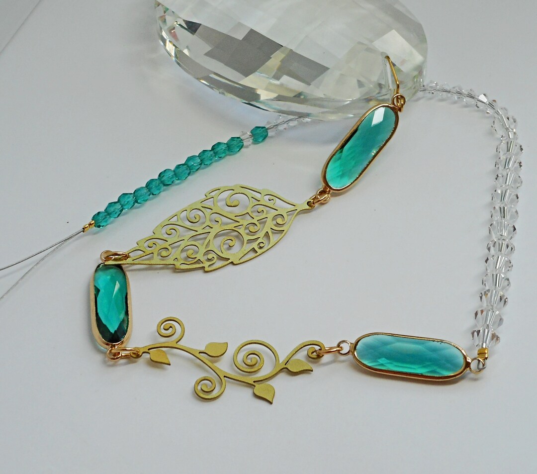 Green Accents With a Big Crystal Prism Suncatcher. Beautiful Gift for the Month of May or for