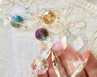 Minimalist style suncatcher with stars and large round crystals. Simple design big on sparkles.